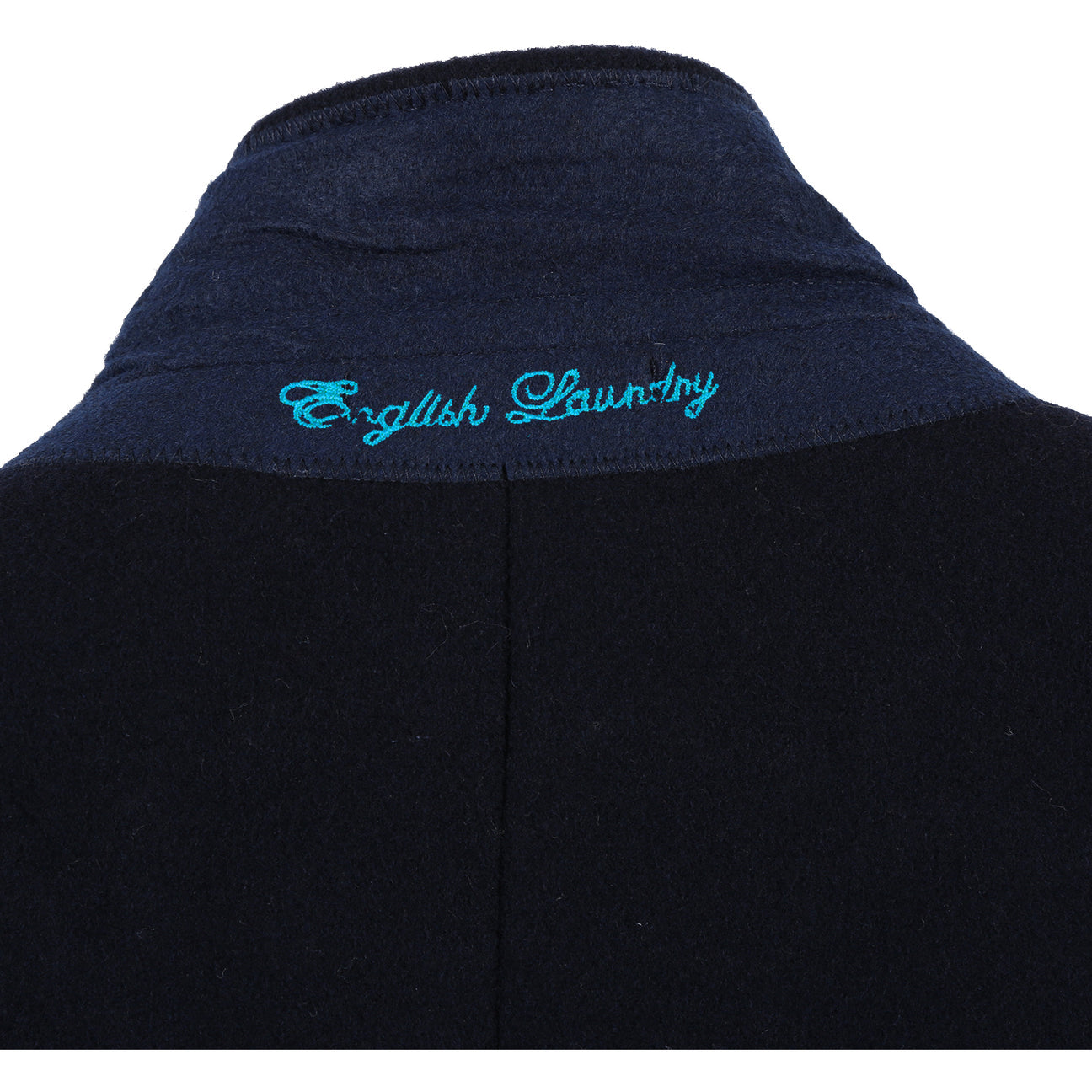 The ENGLISH LAUNDRY Wool Blend Breasted Navy Top Coat EL53-01-410 by English Laundry is a versatile choice that can perfectly complement a black suit jacket, a white shirt, and a black tie with small white dots, creating an elegant layered look suitable for any occasion.