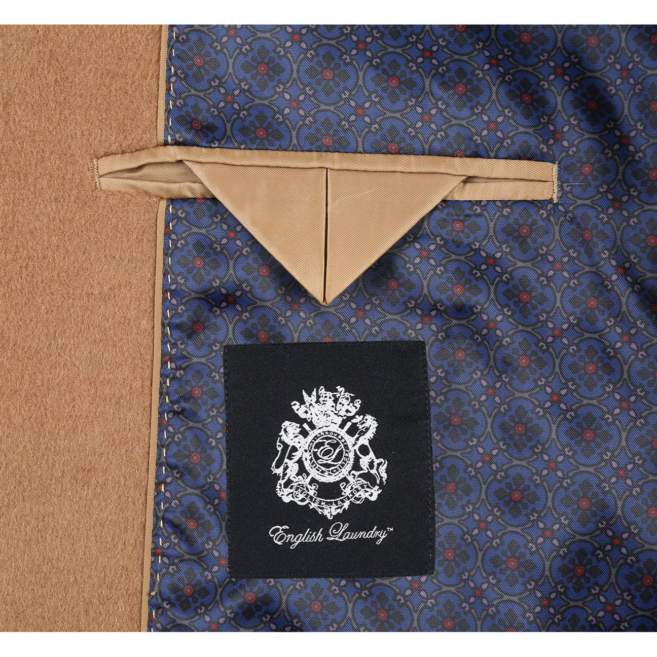 ENGLISH LAUNDRY's Wool Blend Breasted Camel Top Coat EL53-01-600 features a sleek single-breasted design, three buttons, notch lapels, and practical flap pockets. It pairs effortlessly with a crisp white shirt and a sophisticated navy polka dot tie.