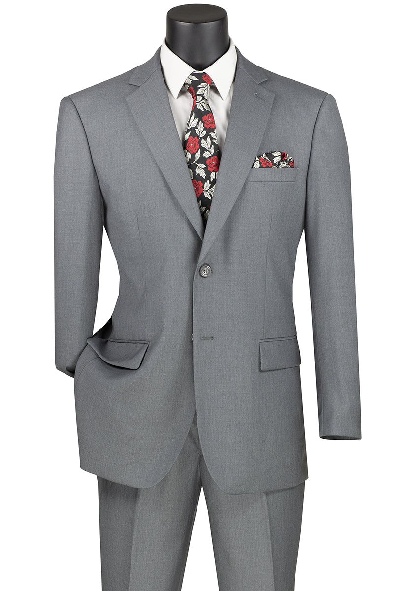 Displayed on a mannequin, the Vinci Suits 2 Piece Suit F-2C900 in medium gray features a floral tie and matching pocket square. Designed for comfort with a 2″ adjustable waistband, it offers a luxurious wool feel, perfect for elevating any occasion.