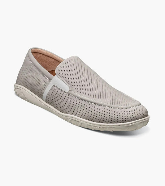 The STACY ADAMS Ilan Perf Moc Toe Slip On in Chalk features perforated leather, breathable linings, and a textured rubber sole. Shown at an angle on a white background. Style: 25512-124.