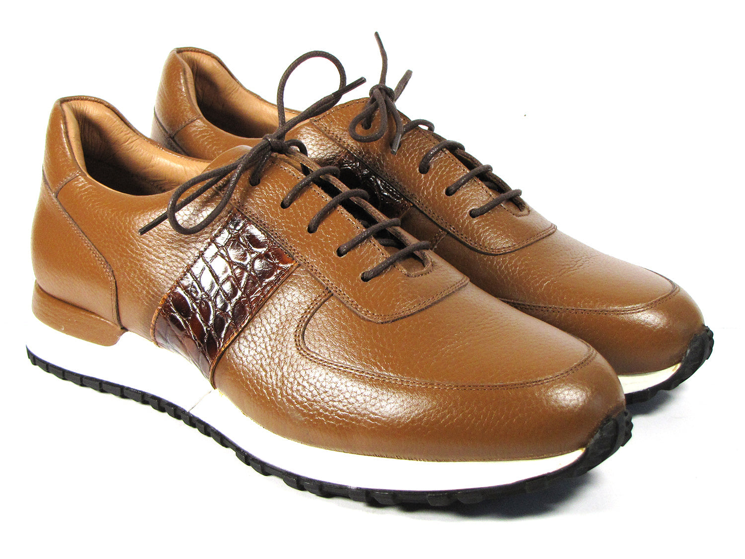 These Paul Parkman Men's Cognac Floater Leather Sneakers - LP206CGN feature a sleek brown leather design with cognac floater leather accents, complemented by white soles and dark brown laces, all beautifully showcased on a white background. Celebrate individuality with this made-to-order item from the Paul Parkman brand, perfect for those who value exceptional craftsmanship.