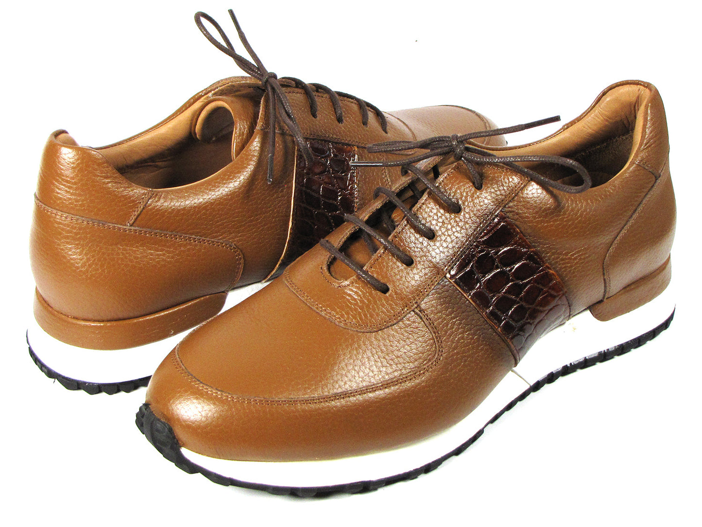 These Paul Parkman Men's Cognac Floater Leather Sneakers - LP206CGN feature a sleek brown leather design with cognac floater leather accents, complemented by white soles and dark brown laces, all beautifully showcased on a white background. Celebrate individuality with this made-to-order item from the Paul Parkman brand, perfect for those who value exceptional craftsmanship.
