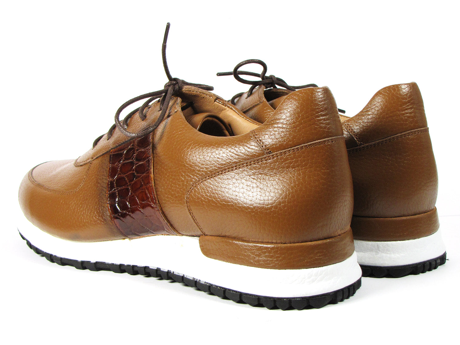 These hand-painted sneakers, featuring the Paul Parkman Men's Cognac Floater Leather design (model: LP206CGN), are crafted from brown leather with dark brown laces and white soles, showcased against a white background.