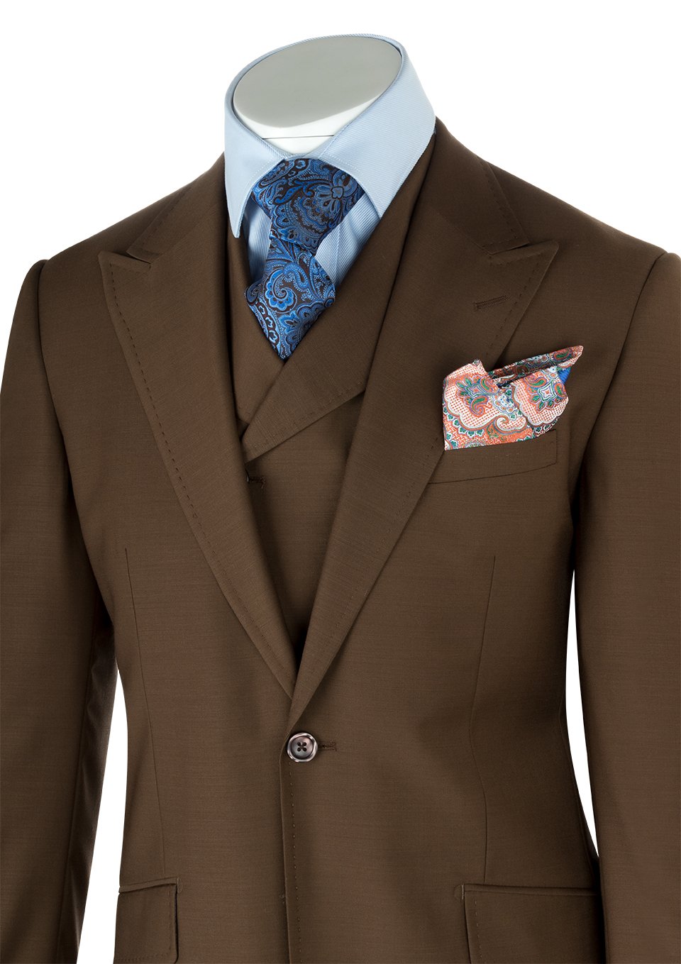 A sophisticated three-piece ensemble is elegantly displayed on a mannequin, featuring the Tiglio Rosso San Giovesse Tobacco suit paired with a blue patterned tie, matching pocket square, and a light blue shirt, all exemplifying the elegance of 100% wool.