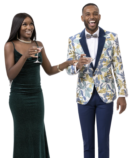 A woman in a green dress and a man wearing the EJ Samuel Blue Blazer J119, featuring velvet fabric and notch lapels, stand together, smiling and holding drinks.