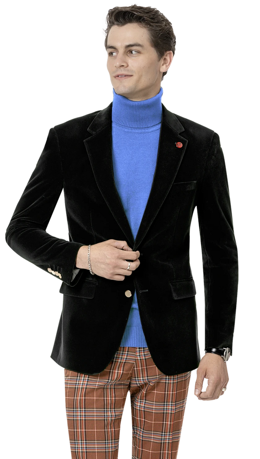 A person wearing an EJ SAMUEL Black Velvet Blazer J134 with gold buttons, a blue turtleneck, and plaid pants holds the blazer button while looking to the side.