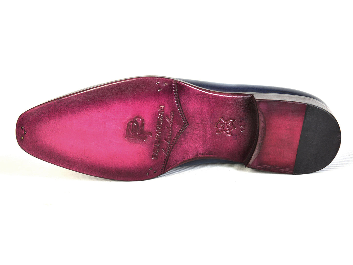 The Paul Parkman Men's Plain Toe Wholecut Oxfords in Blue, also known as model 755-BLU, boast a striking hand-painted gradient effect. These exquisite handmade shoes feature elegant blue laces and a classic wooden heel, embodying unrivaled craftsmanship and style.