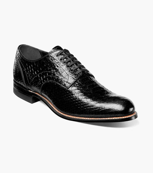 The Stacy Adams MADISON Anaconda Plain Toe Oxford in black showcases a stylish, snake-like pattern with its elegant anaconda print, complemented by a low heel, all displayed on a plain white background.