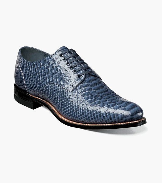 The STACY ADAMS Madison Anaconda Plain Toe Oxford in blue (00055-400) features an anaconda print leather upper, lace-up design, and low black heel, shown as a single dress shoe against a white background.