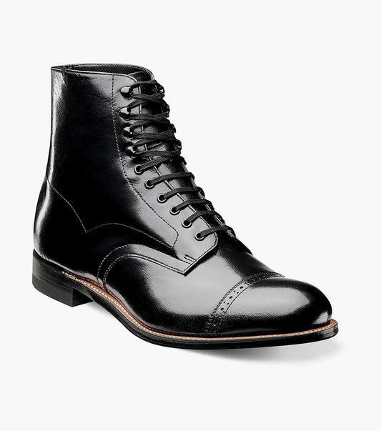 The Stacy Adams MADISON Cap Toe Boot in black, model 00015-01, features a refined design with a polished finish and cap toe. Constructed using Goodyear welt technology, it offers lasting durability and classic style.