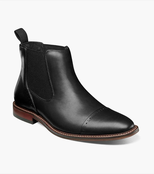 The Stacy Adams Maury Cap Toe Chelsea Boot in black features elastic side panels, a back pull tab, cap toe detailing, and a brown sole with light stitching. Crafted from burnished leather for added style. Style: 25492-001 by STACY ADAMS.
