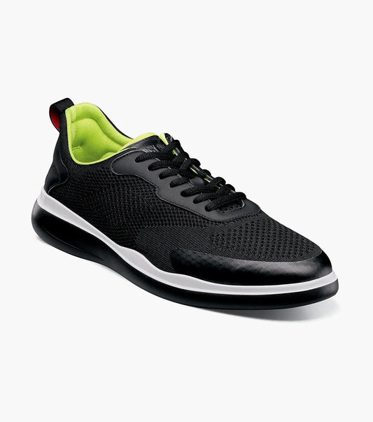 The STACY ADAMS Maxson Moc Toe Lace Up Sneaker (Black, 25517-001) features a black mesh upper, neon green lining, white sole, and black laces—offering comfort on or off the court. Shown on a white background.