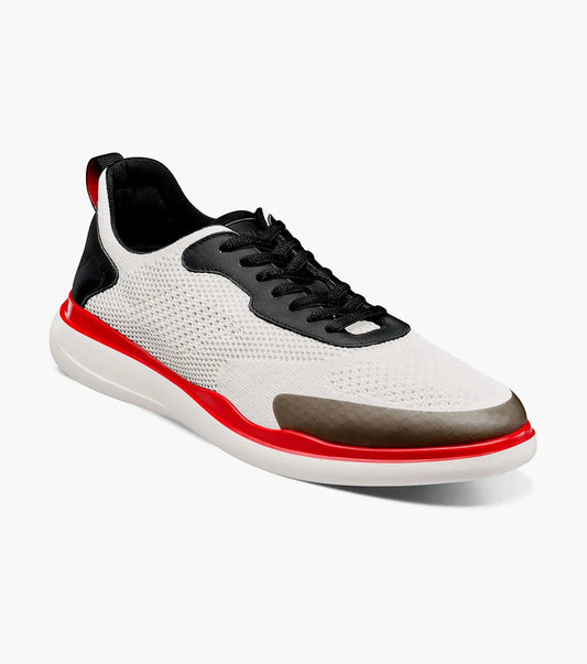 The Stacy Adams Maxson Moc Toe Lace Up Sneaker in White Multi features black laces, a black heel, brown toe cap, red sole accent, and arch support for comfort. Displayed on a white background. Brand: STACY ADAMS. Model: 25517-110.