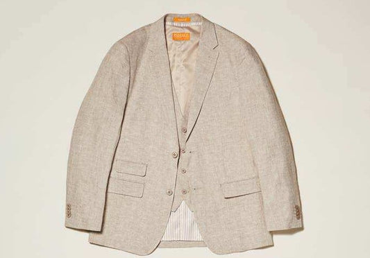 The Inserch Classic Linen Blazer SU66010-00006 Oatmeal by Inserch has a two-button front, notched lapels, and a matching vest. It features two flap pockets and one chest pocket, elegantly showcased on an oatmeal background.