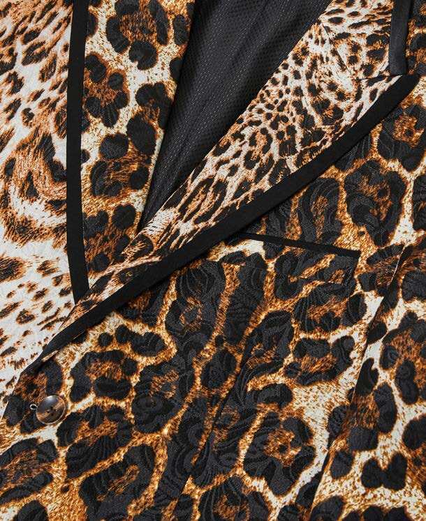 The Inserch Leopard & Cheeta Print Tux Blazer BL200-25 in Brown, a slim-fit design showcasing a blend of light and dark leopard prints, accented with satin peak lapels and multiple pockets, lies flat on a neutral background.