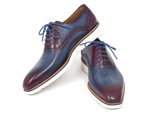 Introducing the Paul Parkman Smart Casual Oxford Shoes Blue & Purple - 184SNK-BLU: A stylish pair of blue leather brogues from Paul Parkman, featuring purple accents, blue laces, and distinctive white soles, perfect for elevating your smart casual look.