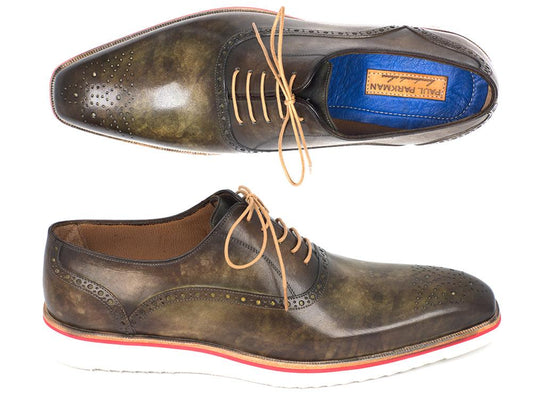 A pair of Paul Parkman Smart Casual Oxford Shoes in Army Green are displayed, highlighting intricate brogue detailing and vibrant red accents on the sole. One shoe is presented from above and the other from the side, perfectly capturing a blend of refined sophistication with casual charm.