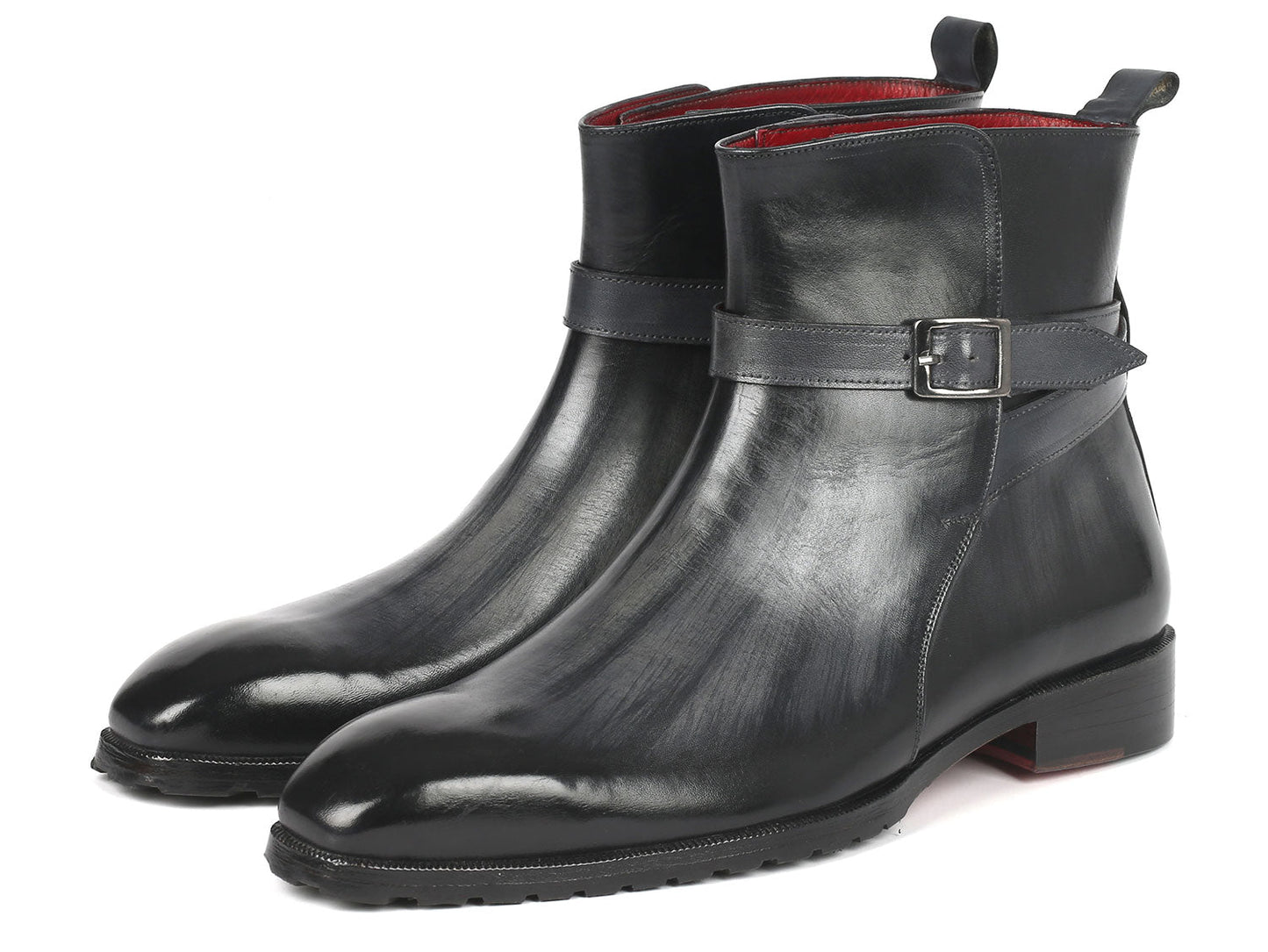 Two gray patina Jodhpur boots from Paul Parkman with a sleek, made-to-order design and a strap detail around the ankle.