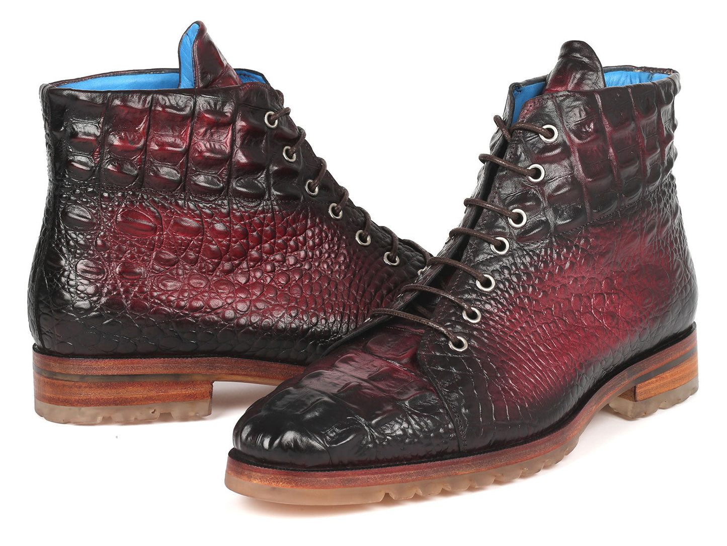 A pair of Paul Parkman Men's Bordeaux Croco Embossed Leather Boots, model 12811-BRD, presenting a striking red and black pattern with a lace-up design, showcased on a pristine white background.