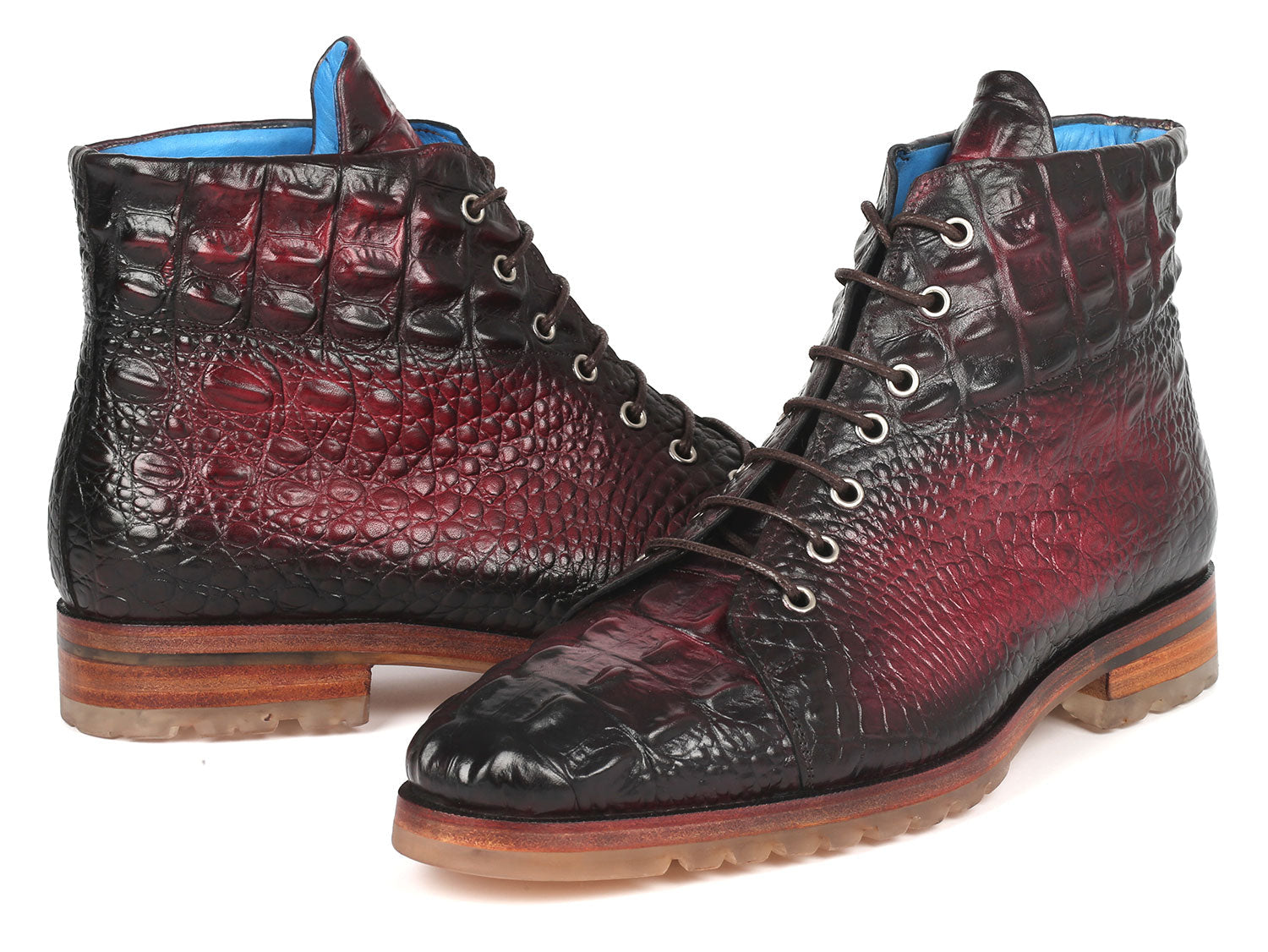 A pair of Paul Parkman Men's Bordeaux Croco Embossed Leather Boots, model 12811-BRD, presenting a striking red and black pattern with a lace-up design, showcased on a pristine white background.