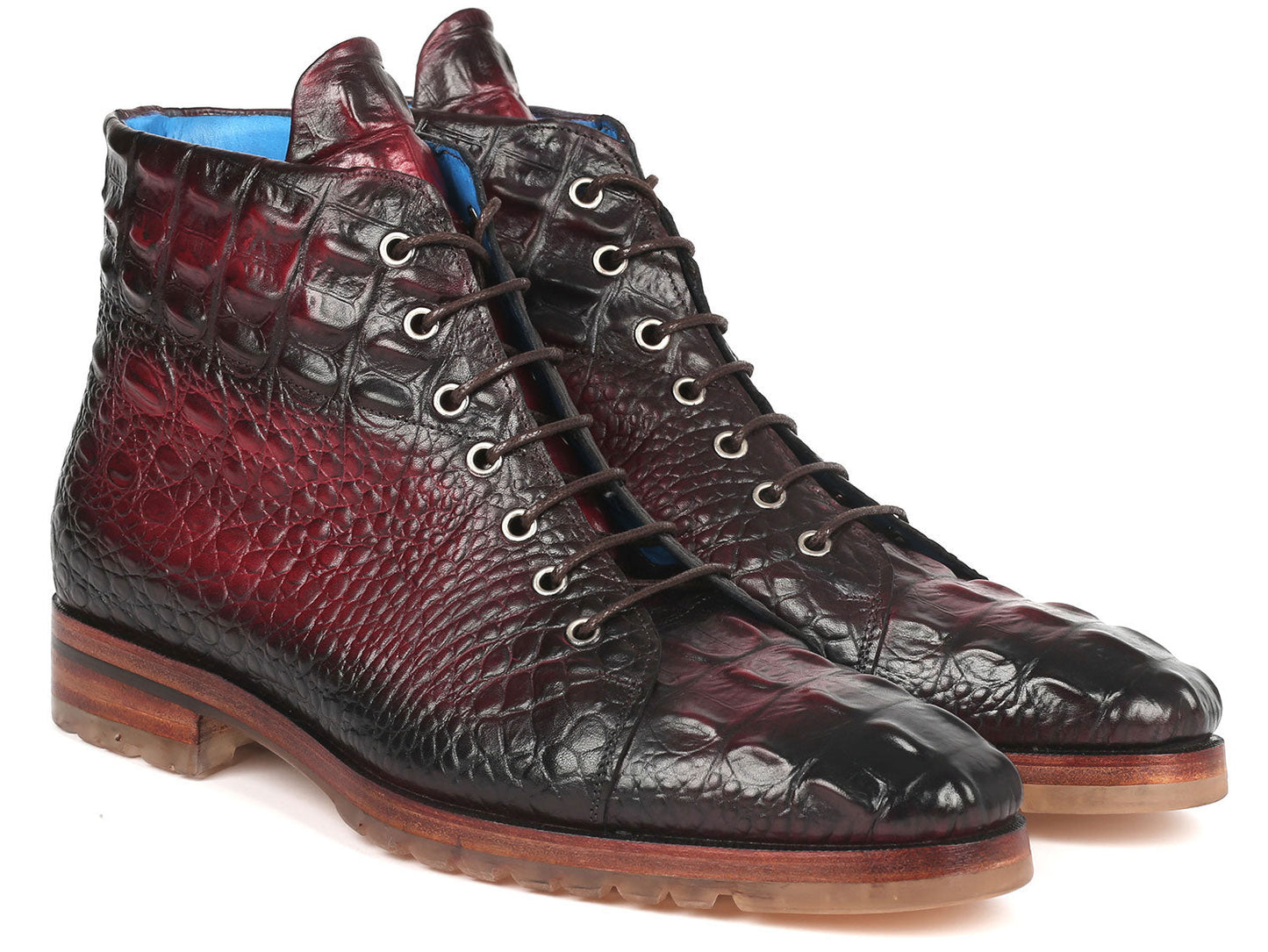 A pair of Paul Parkman Men's Bordeaux Croco Embossed Leather Boots, model 12811-BRD, presenting a striking red and black pattern with a lace-up design, showcased on a pristine white background.