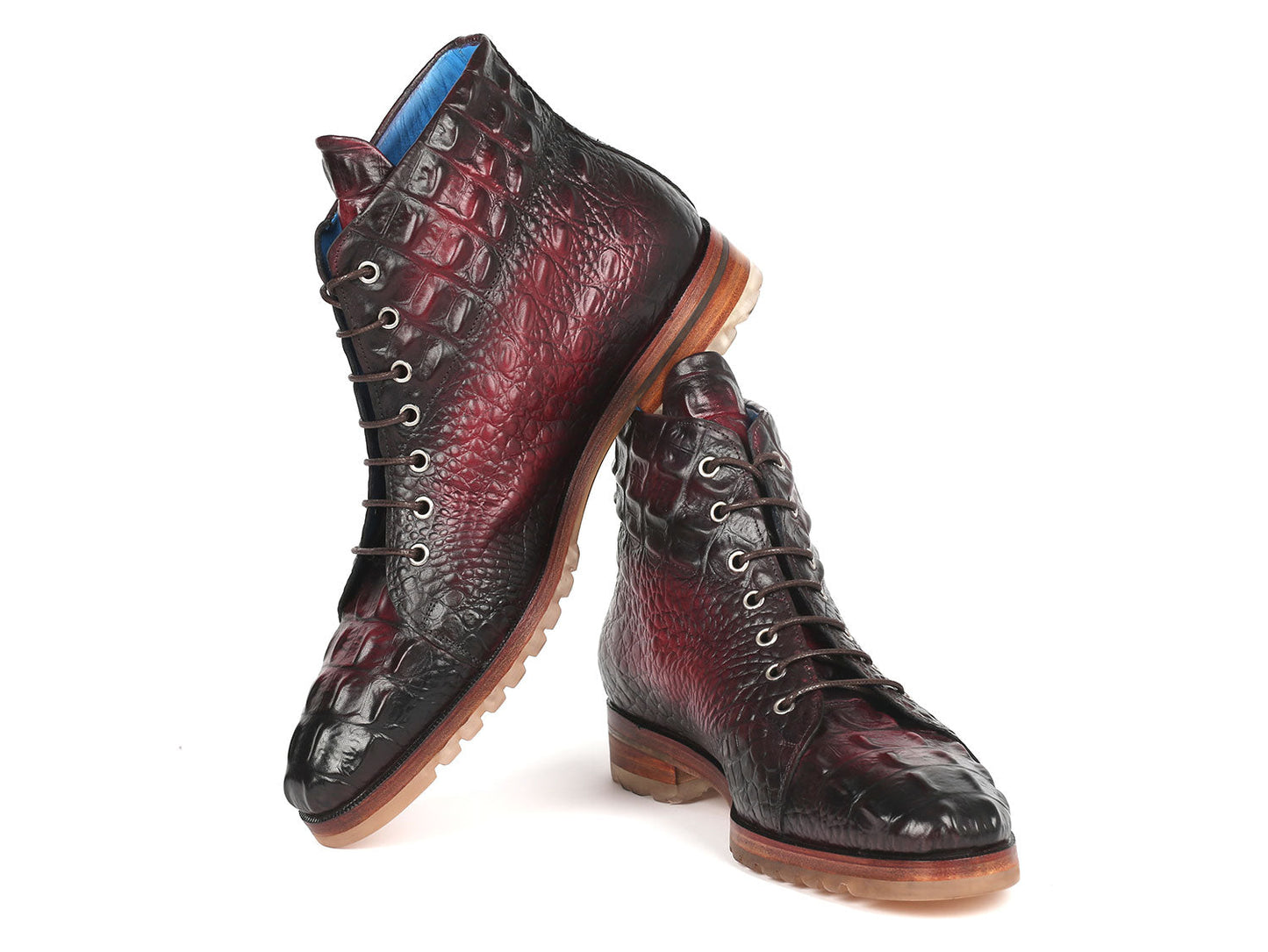 A pair of Paul Parkman Men's Bordeaux Croco Embossed Leather Boots, model 12811-BRD, presenting a striking red and black pattern with a lace-up design, showcased on a pristine white background.