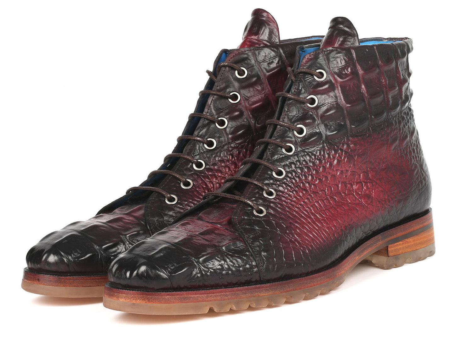 A pair of Paul Parkman Men's Bordeaux Croco Embossed Leather Boots, model 12811-BRD, presenting a striking red and black pattern with a lace-up design, showcased on a pristine white background.