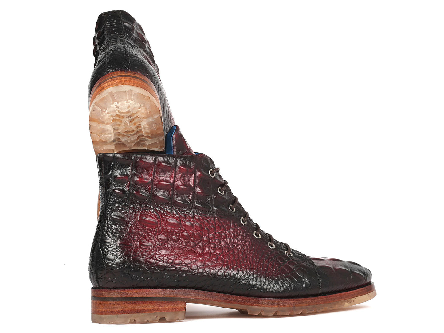 A pair of Paul Parkman Men's Bordeaux Croco Embossed Leather Boots, model 12811-BRD, presenting a striking red and black pattern with a lace-up design, showcased on a pristine white background.