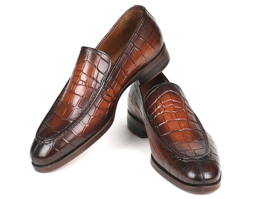 The Paul Parkman Brown Burnished Crocodile Embossed Calfskin Loafer (model 7339-BRW) showcases a striking crocodile pattern, with one loafer standing upright and the other resting horizontally across it.
