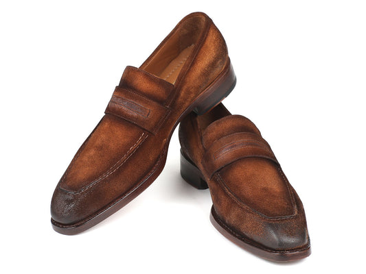 The Paul Parkman Brown Antique Suede Goodyear Welted Loafers - 36AQ17, featuring a penny strap detail and suede upper, with one shoe slightly leaning on the other.