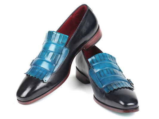 Introducing the Paul Parkman Blue & Navy Kiltie Double Monkstraps (ST17BLU), exquisite black leather dress shoes featuring blue fringed accents and red soles, skillfully hand-painted for a distinctive finish.