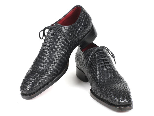 The Paul Parkman Black Woven Leather Oxfords - 044WN86, showcased from a slightly angled front view, highlight their refined craftsmanship with hand-painted double leather soles and laces.