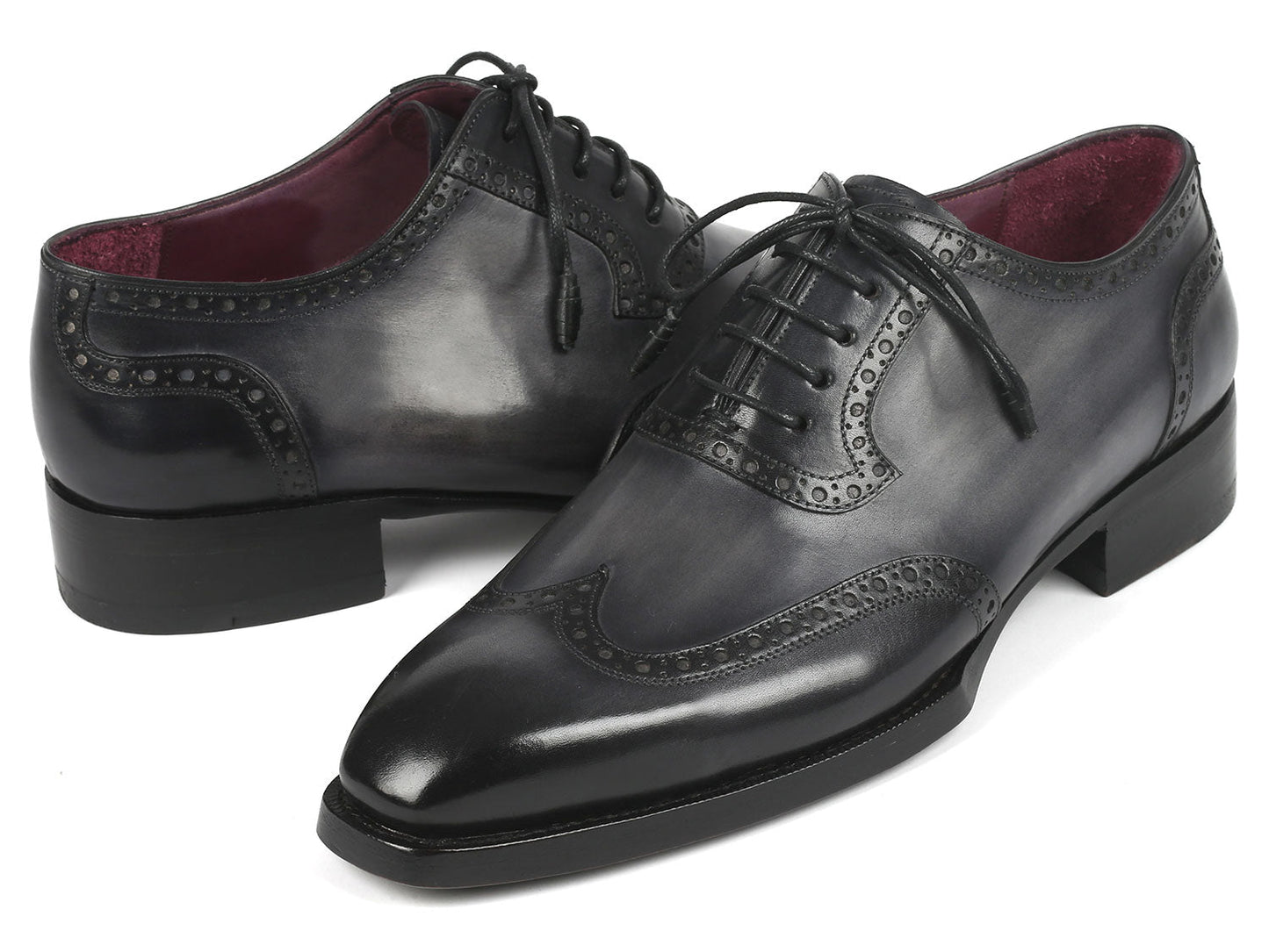 A pair of Paul Parkman Goodyear Welted Men's Wingtip Oxfords in black and gray, style number 6819-GRY, featuring polished leather with exquisite decorative broguing and laces.