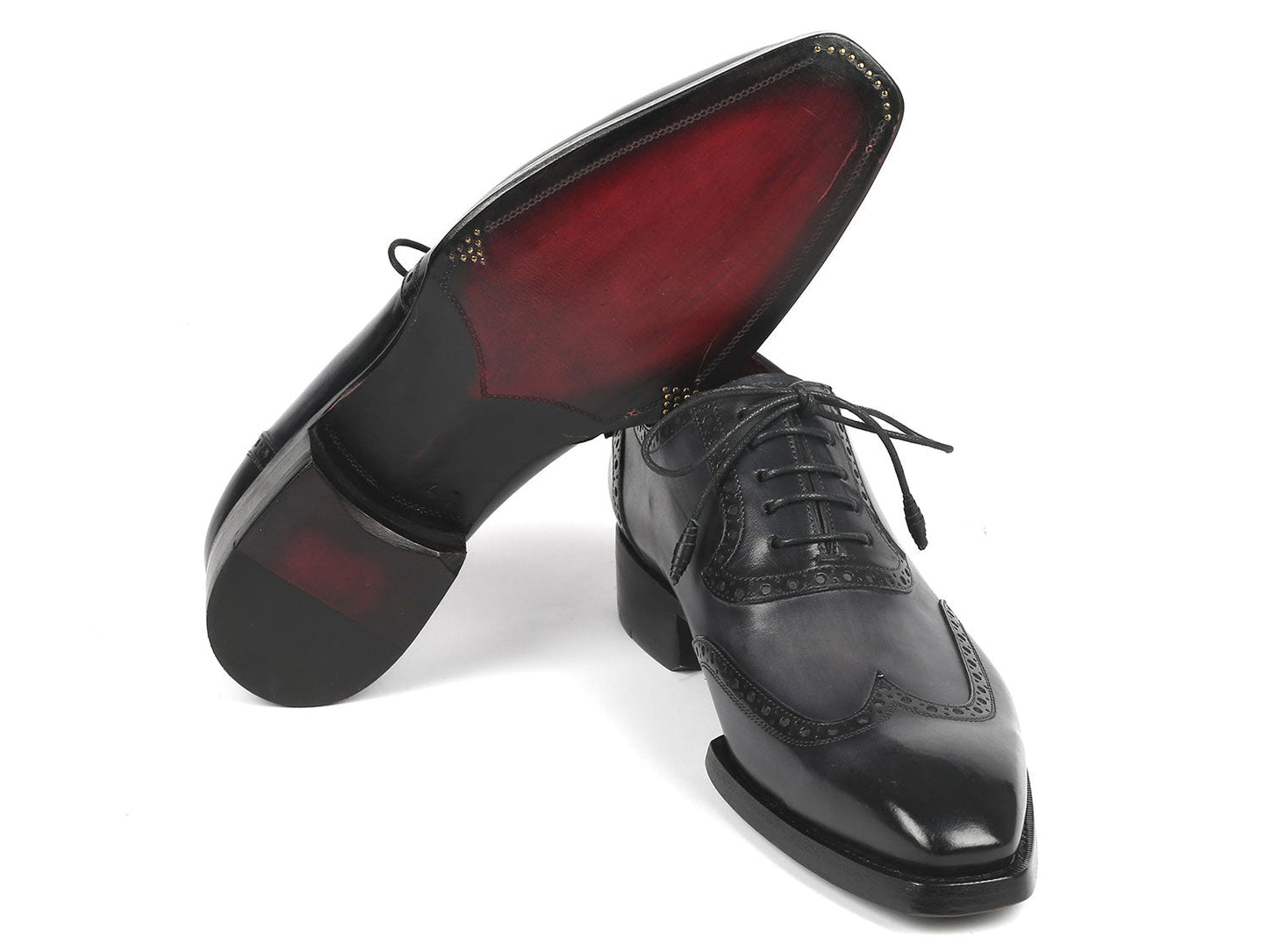 A pair of Paul Parkman Goodyear Welted Men's Wingtip Oxfords in black and gray, style number 6819-GRY, featuring polished leather with exquisite decorative broguing and laces.