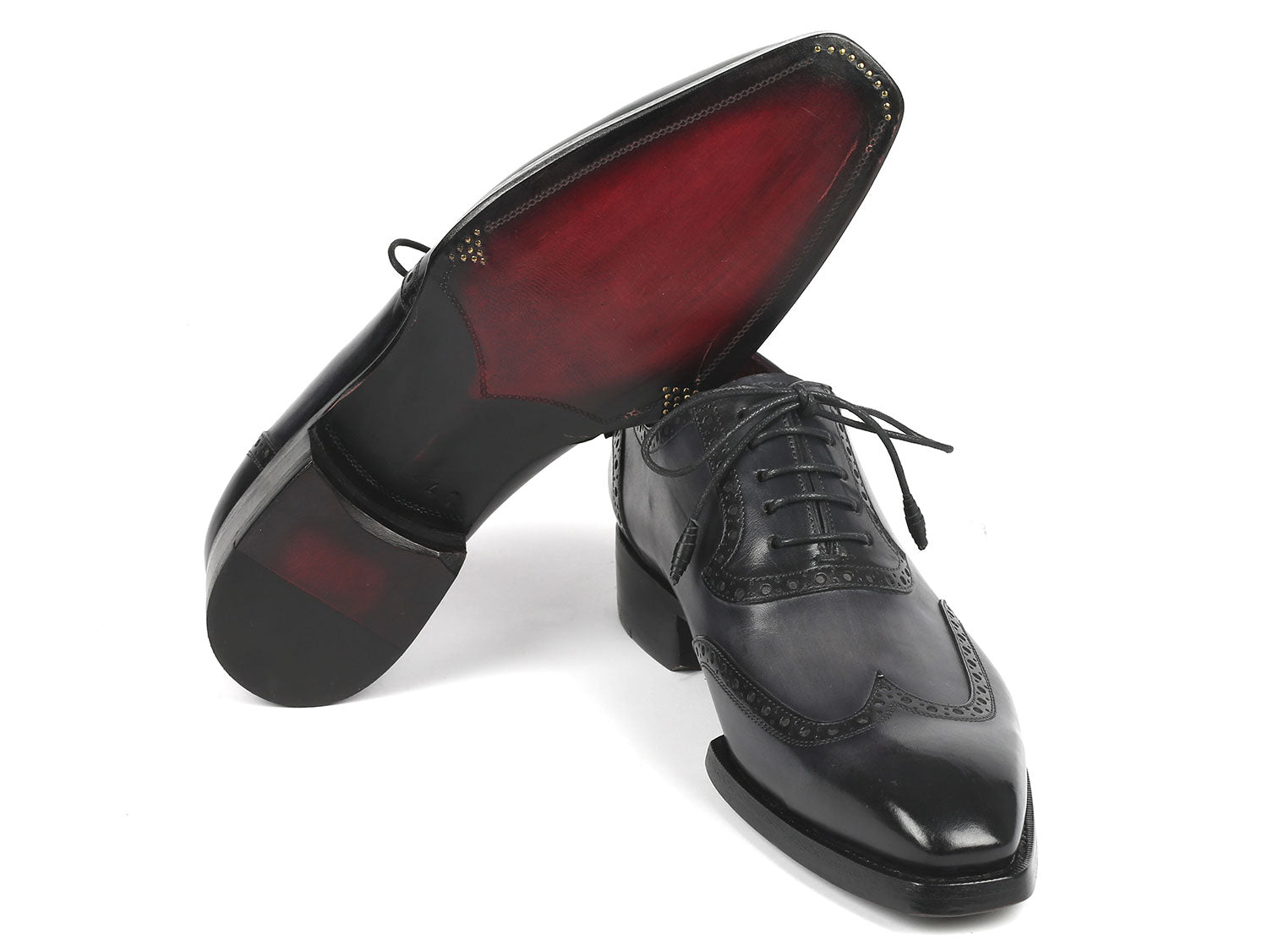 A pair of Paul Parkman Goodyear Welted Men's Wingtip Oxfords in black and gray, style number 6819-GRY, featuring polished leather with exquisite decorative broguing and laces.