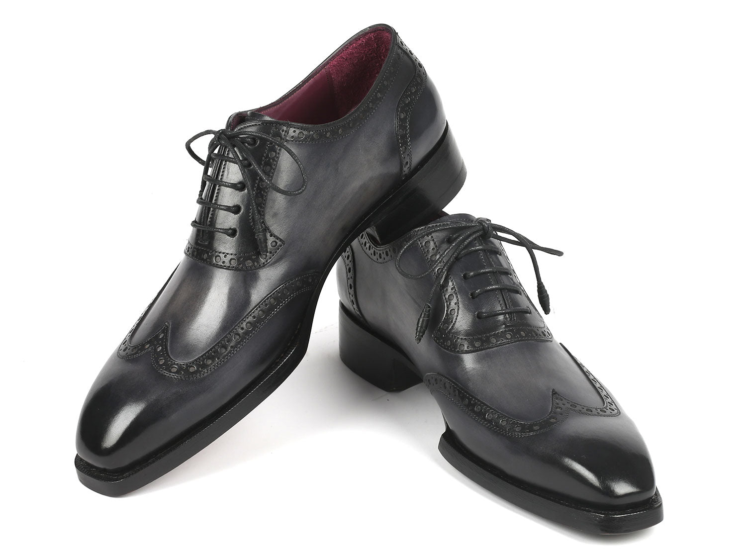 A pair of Paul Parkman Goodyear Welted Men's Wingtip Oxfords in black and gray, style number 6819-GRY, featuring polished leather with exquisite decorative broguing and laces.