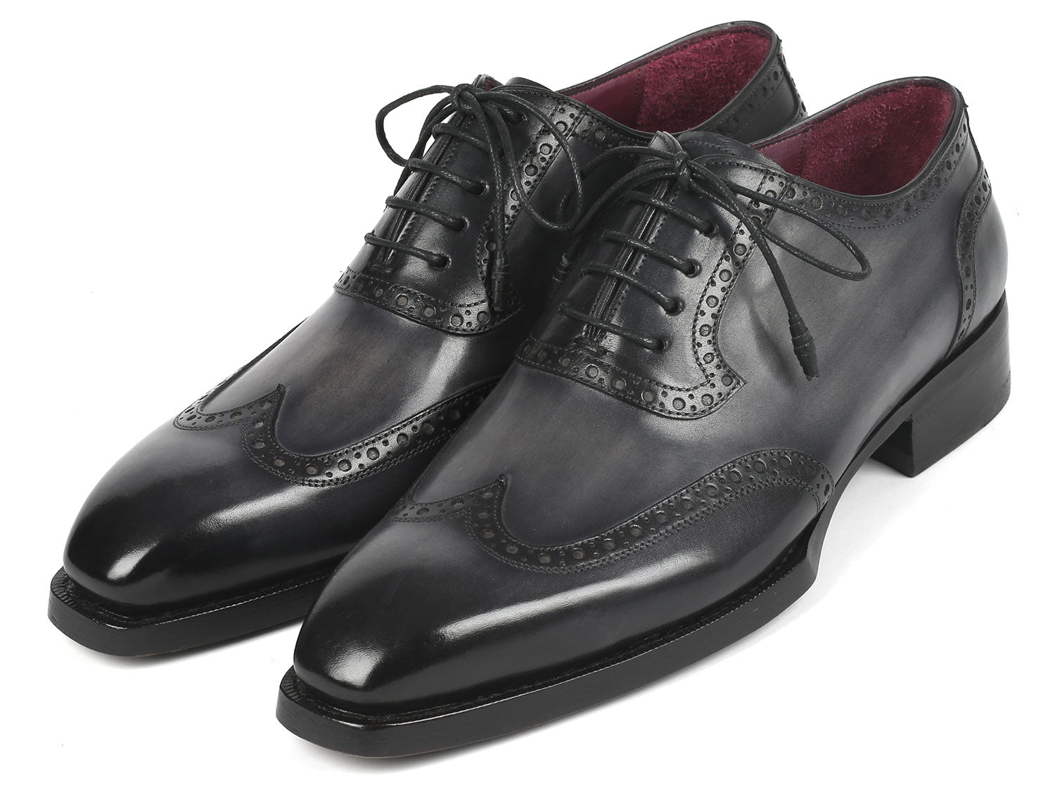 A pair of Paul Parkman Goodyear Welted Men's Wingtip Oxfords in black and gray, style number 6819-GRY, featuring polished leather with exquisite decorative broguing and laces.