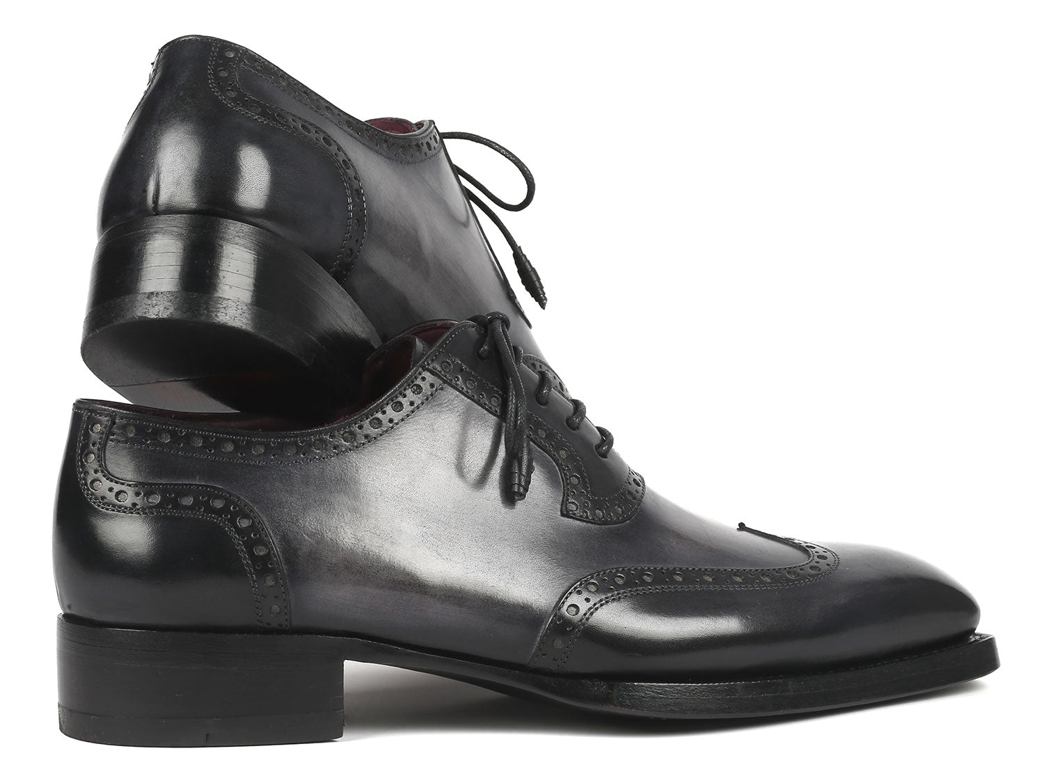 A pair of Paul Parkman Goodyear Welted Men's Wingtip Oxfords in black and gray, style number 6819-GRY, featuring polished leather with exquisite decorative broguing and laces.