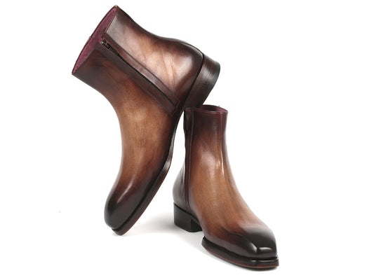 The Paul Parkman Brown Burnished Side Zipper Boots Goodyear Welted (BT3955-BRW) boast an elegant design with their glossy brown gradient finish and convenient side zippers, complemented by a low heel.