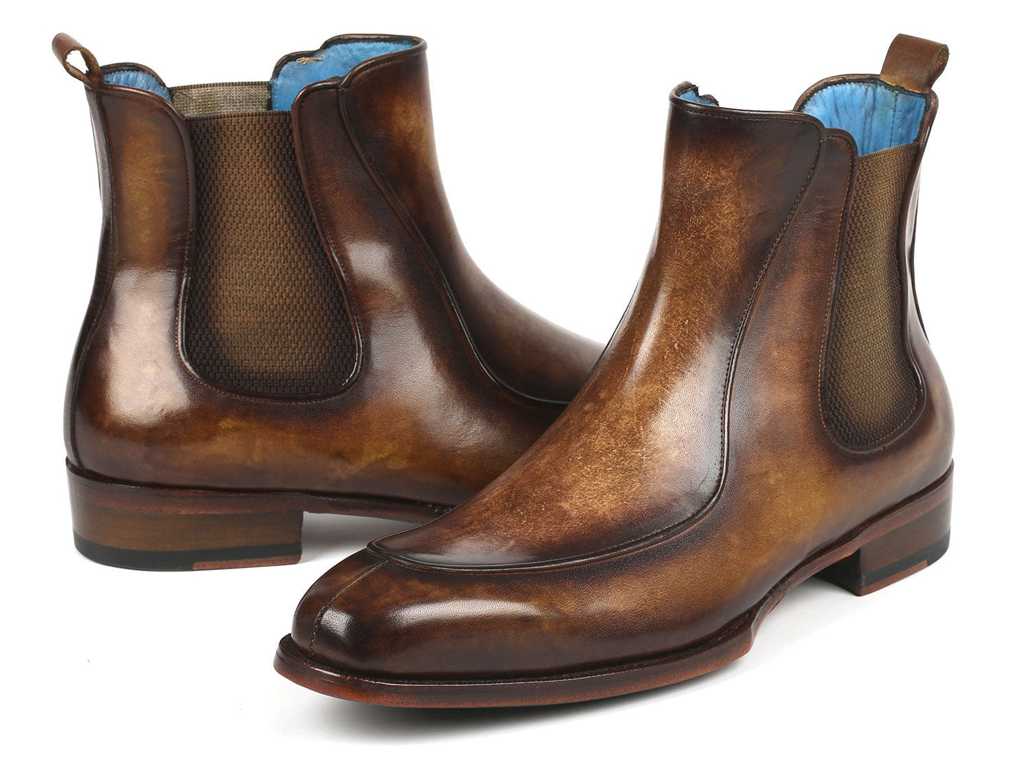 The Paul Parkman Men's Brown Handpainted Chelsea Boots Goodyear Welted - BT822BRW are meticulously crafted from hand-painted leather with a polished finish, featuring elastic side panels and a low heel.