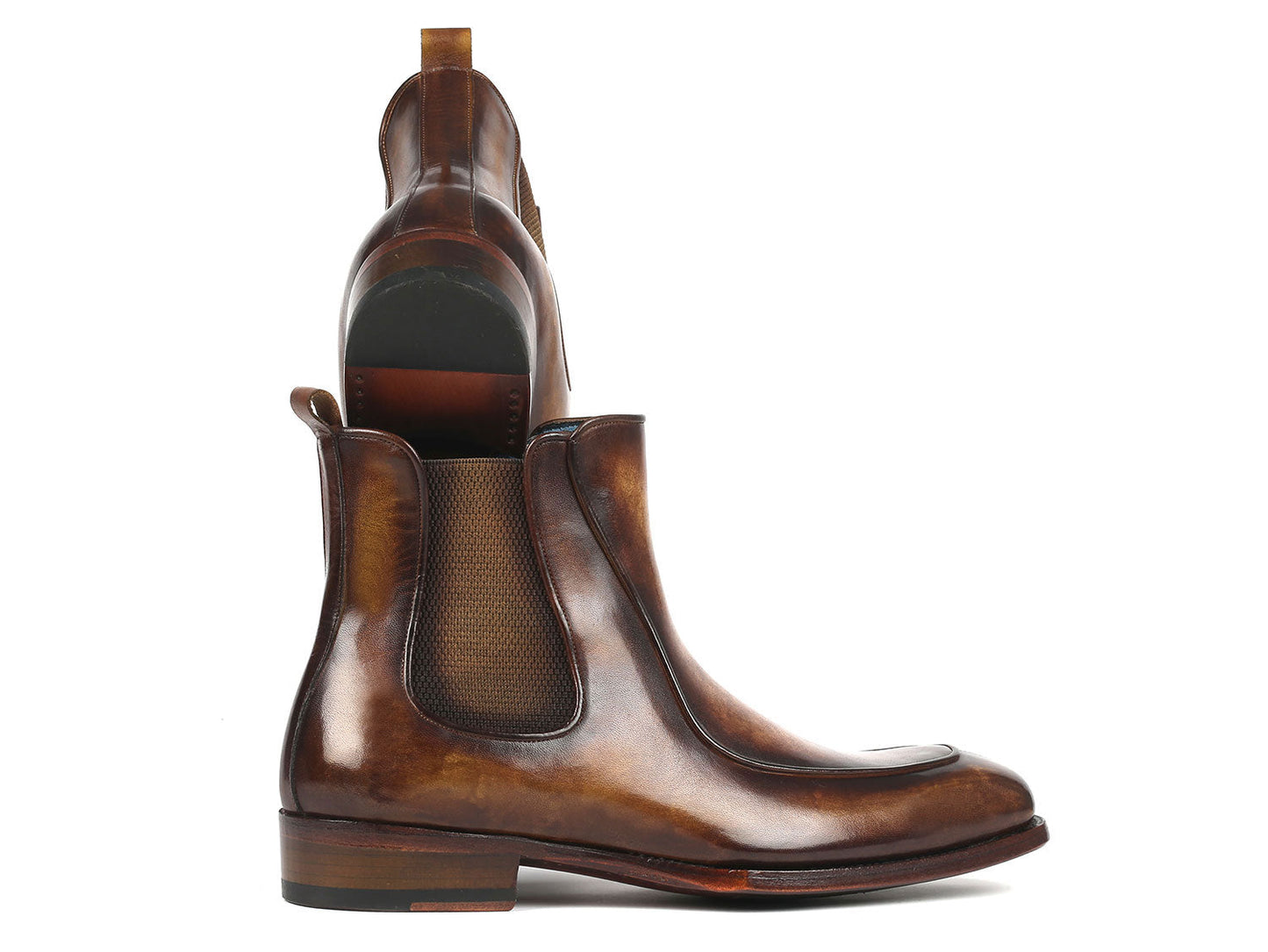 The Paul Parkman Men's Brown Handpainted Chelsea Boots Goodyear Welted - BT822BRW are meticulously crafted from hand-painted leather with a polished finish, featuring elastic side panels and a low heel.