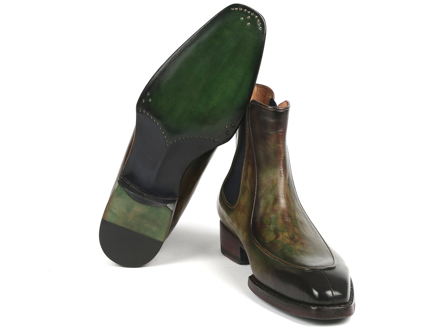 The Paul Parkman Men's Green Handpainted Chelsea Boots, featuring Goodyear welted construction, elastic side panels, and wooden heels, are stylishly displayed with one propped against the other.