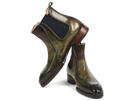 The Paul Parkman Men's Green Handpainted Chelsea Boots, featuring Goodyear welted construction, elastic side panels, and wooden heels, are stylishly displayed with one propped against the other.