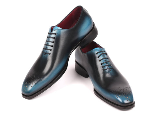 Introducing the Paul Parkman Black & Blue Wholecut Oxfords - KR884BLU, a meticulously crafted handmade pair in striking black and blue.