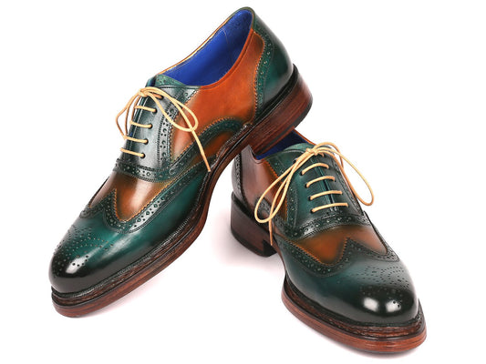 The Paul Parkman Wingtip Oxfords Goodyear Welted Green & Tobacco - 027-GRN-TAB for men showcase a stunning combination of green and brown leather, complemented by blue lining and beige laces. These expertly crafted brogue shoes feature a Goodyear welt construction, providing lasting style and comfort.