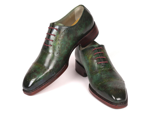 Introducing the Paul Parkman Green Marble Patina Goodyear Welted Oxfords (56GRN37): a stylish pair of green leather dress shoes with red laces, featuring hand-painted leather and exquisite brogue detailing. These made-to-order shoes by Paul Parkman are crafted with Goodyear welted construction, ensuring durability and timeless style.