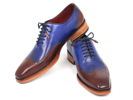 Introducing the Paul Parkman Wingtip Oxford Goodyear Welted Blue & Brown - 81BLU57, a refined creation from Paul Parkman. These shoes feature calfskin uppers in an elegant two-tone design with blue and brown accents, complemented by laces and sturdy wooden soles. Expertly handmade with Goodyear welted construction, they promise unmatched durability and stylish sophistication.