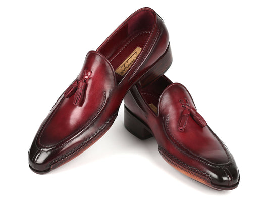 The Paul Parkman Hand-Sewn Tassel Loafers Bordeaux - 082-BRD, crafted by Paul Parkman, are a pair of men's shoes that feature hand-painted burgundy leather with dark soles and boast a polished finish on a white background.