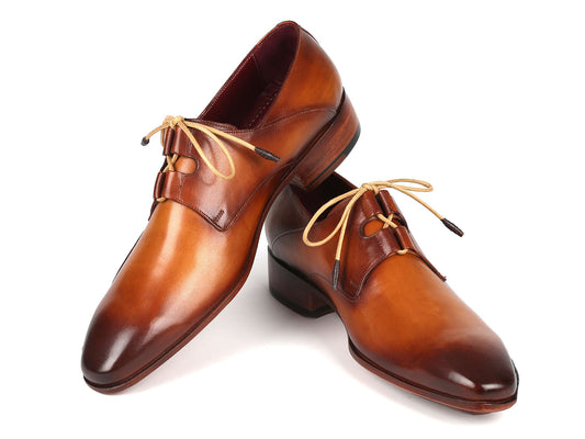 The Paul Parkman Ghillie Lacing Handsewn Shoes in light brown, crafted with opanka construction and featuring tan laces, are elegantly displayed on a white background.