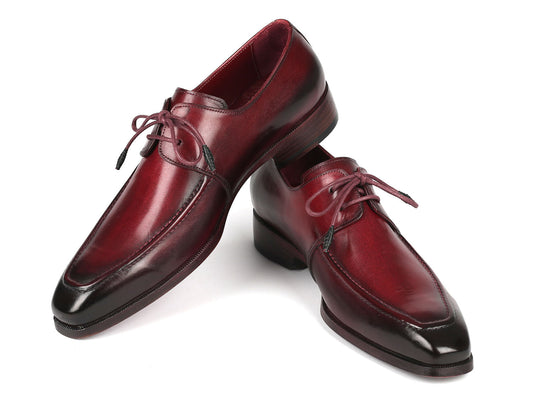 The Paul Parkman Bordeaux Leather Apron Derby Shoes - 13BRD92, crafted from hand-painted calfskin with laces and featuring a subtle shine and darkened toe caps, are set against a plain background.